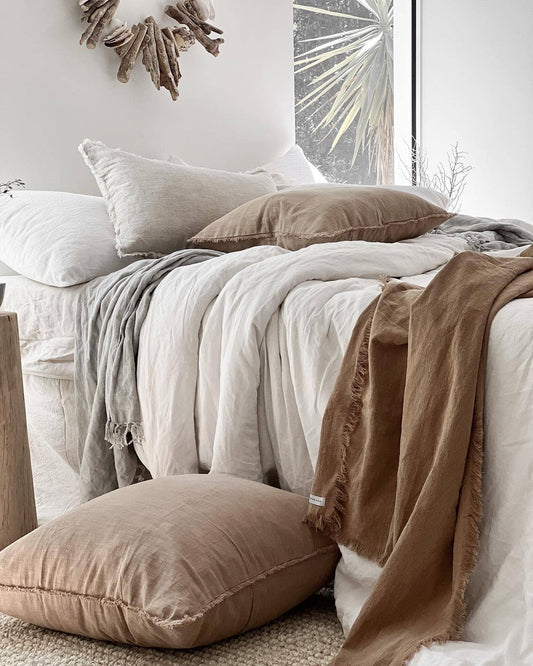 Cozy bedroom with pillows and blankets on a bed