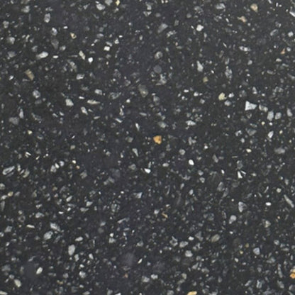 Close-up of a black textured surface with small white and gray specks