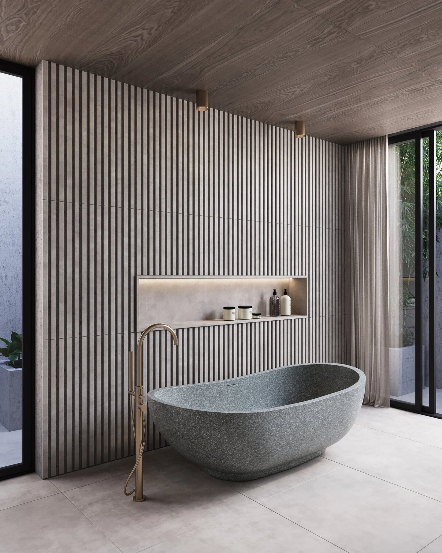 Modern bathroom with a freestanding stone bathtub and striped wall tiles.