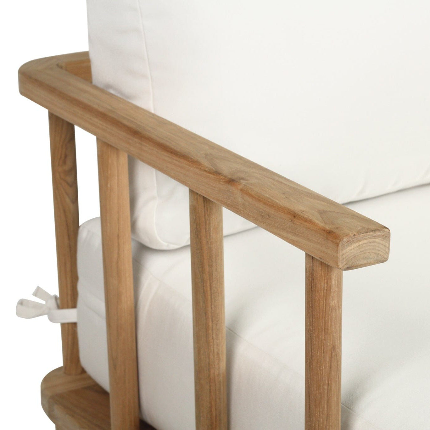 Wooden armrest on a white sofa